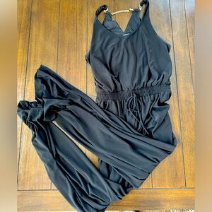 Black jumpsuit. Material is to die for!